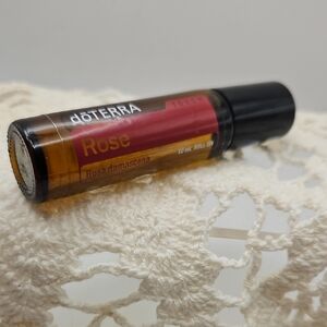 doTERRA Rose Essential Oil Roll-On with Red and Black Accents